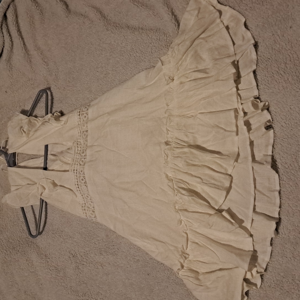 White summer dress. Never been worn. Sleeveless and open back